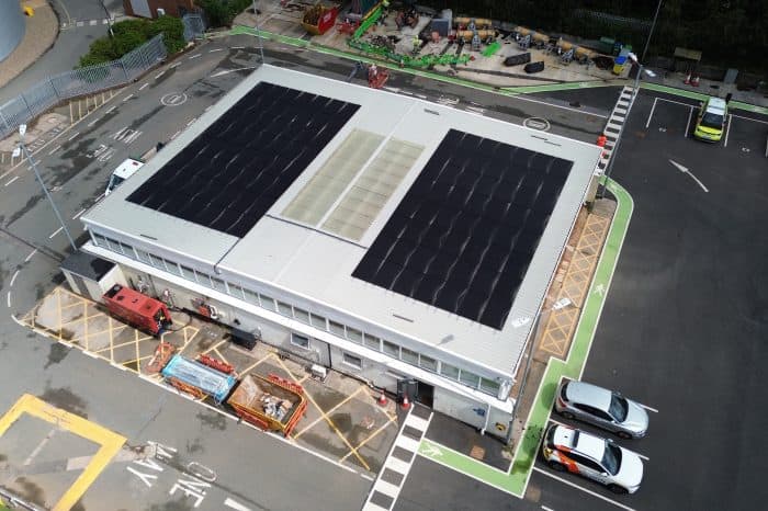 Aerial view of solar panels installed on the roof of a National Highways operational depot.