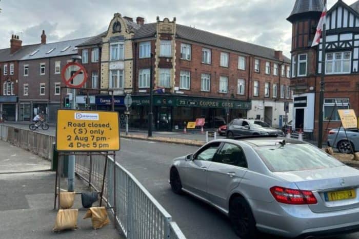 Road closed sign on Tamworth Road, Long Eaton, ahead of pavement widening works.