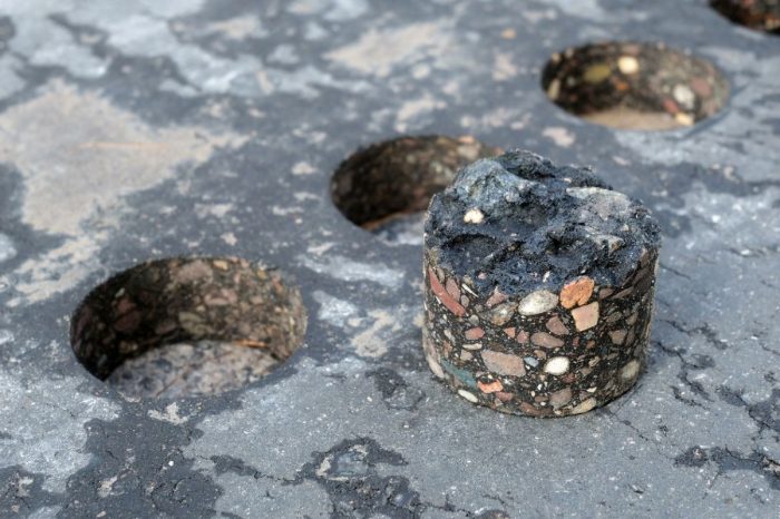 A road material can look brilliant in a test slab and still wait years for a place on a live carriageway.